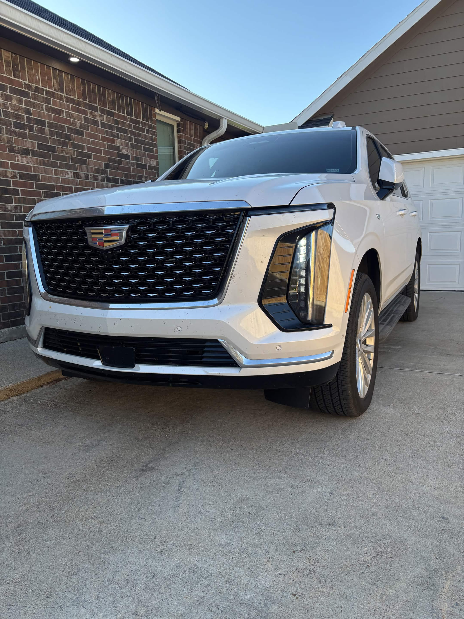 White Cadillac Escalade front three-quarter after detailing