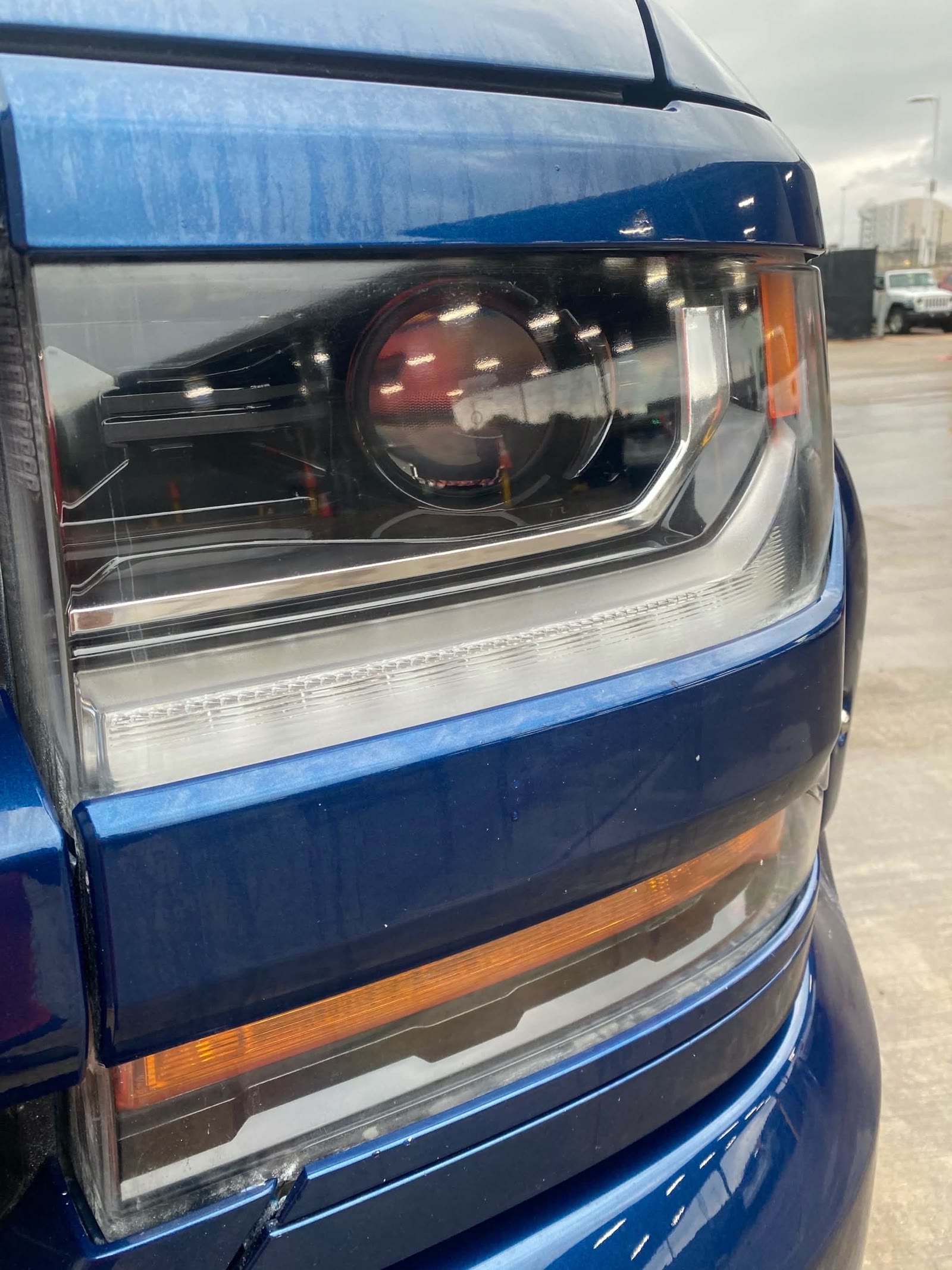 Blue pickup headlight assembly after restoration