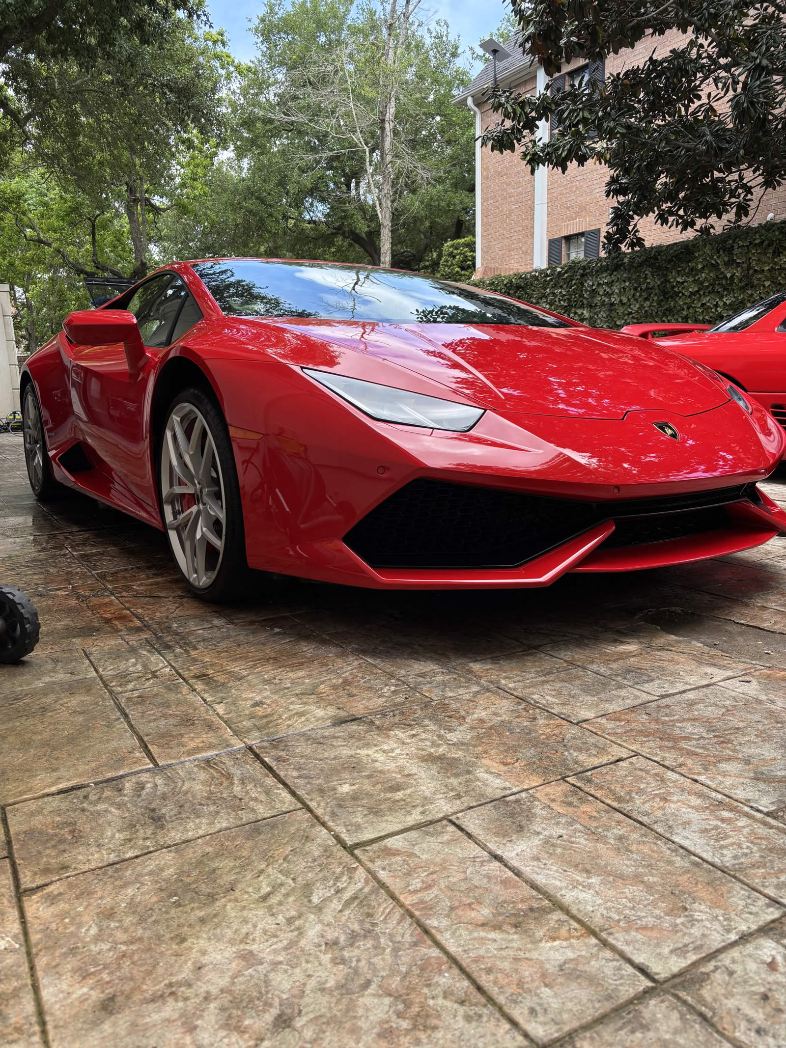 Red Lamborghini Huracán exterior after wash and detail