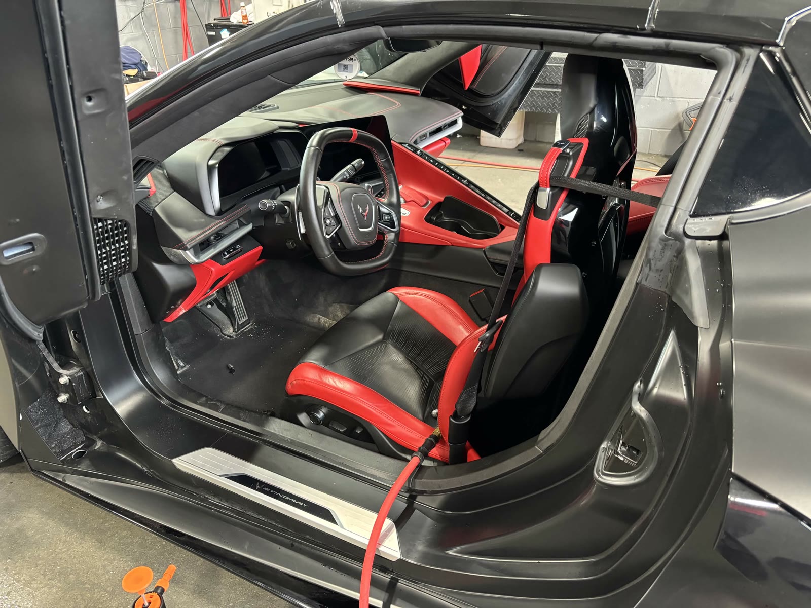 Corvette Stingray red and black interior during detailing